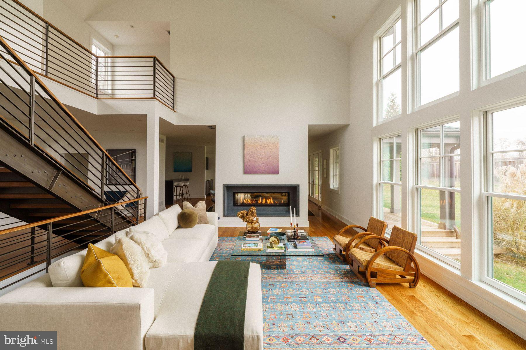 609 St Andrews Road Philadelphia, PA 19118 - Photo 7 of 43 a living room with fireplace furniture and a large window