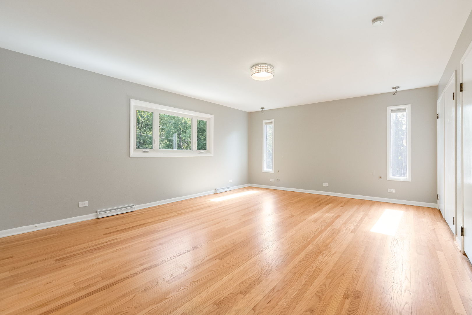 3528 Riverside Drive Wilmette, IL 60091 - Photo 14 of 33 an empty room with wooden floor and windows