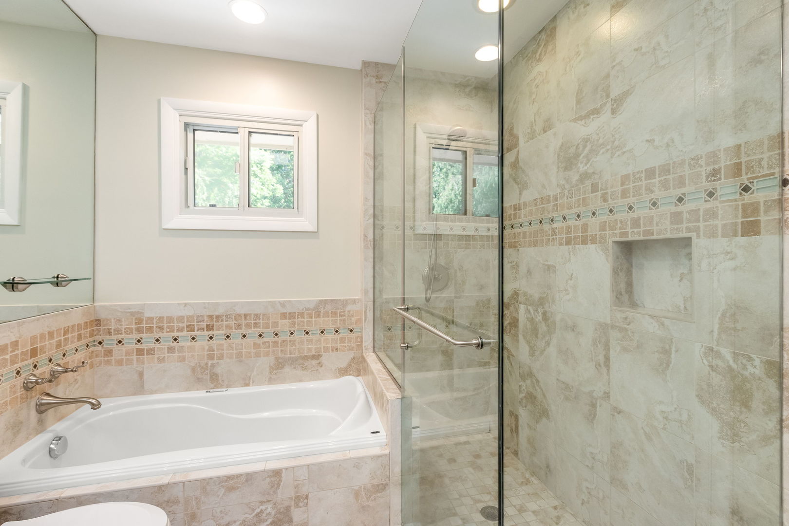 3528 Riverside Drive Wilmette, IL 60091 - Photo 16 of 33 a bathroom with a bathtub and shower