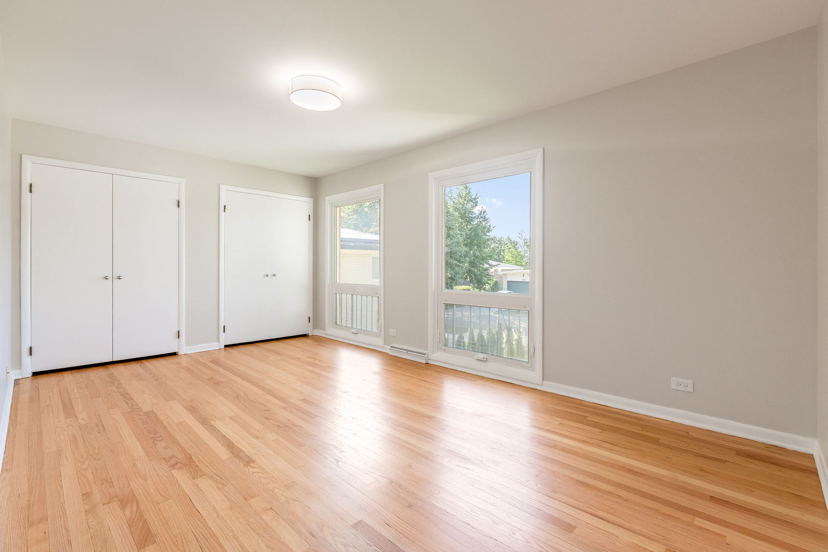 3528 Riverside Drive Wilmette, IL 60091 - Photo 18 of 33 a view of an empty room with wooden floor and a window