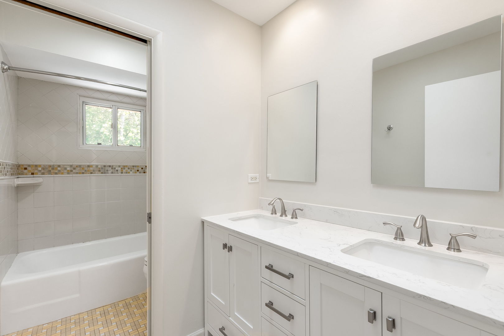 3528 Riverside Drive Wilmette, IL 60091 - Photo 20 of 33 a bathroom with a tub sink double vanity and mirror