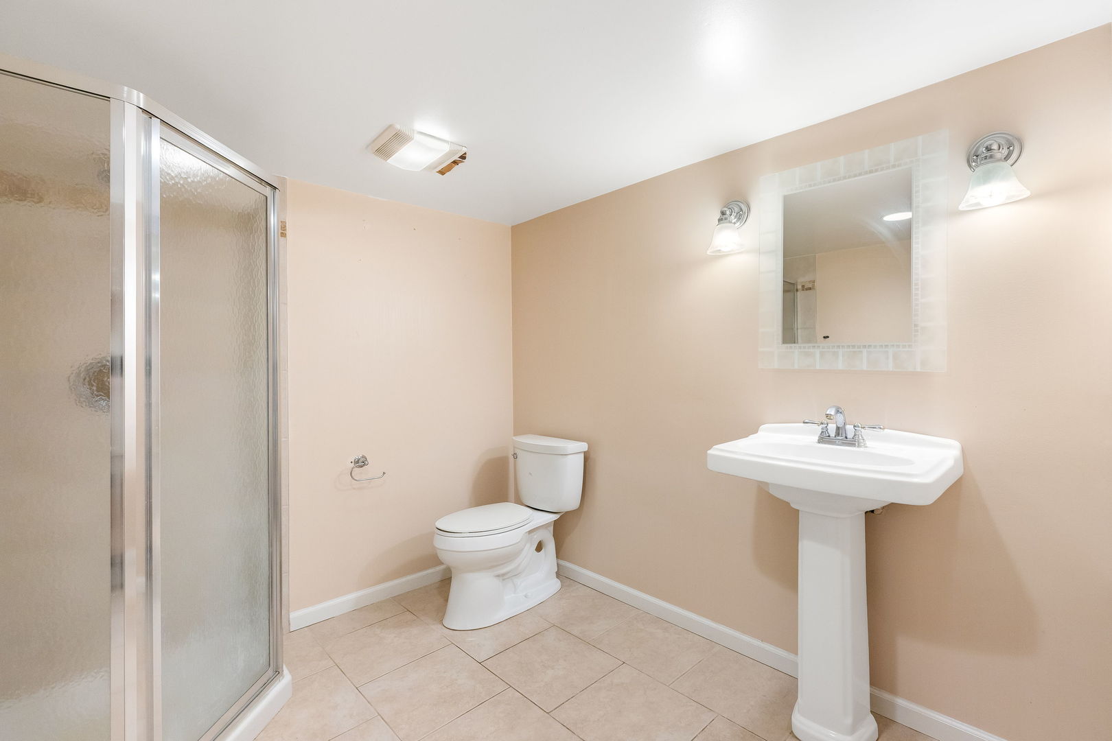 3528 Riverside Drive Wilmette, IL 60091 - Photo 23 of 33 a bathroom with a sink toilet and a mirror