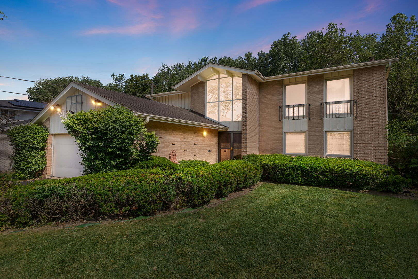 3528 Riverside Drive Wilmette, IL 60091 - Photo 26 of 33 a front view of a house with a garden