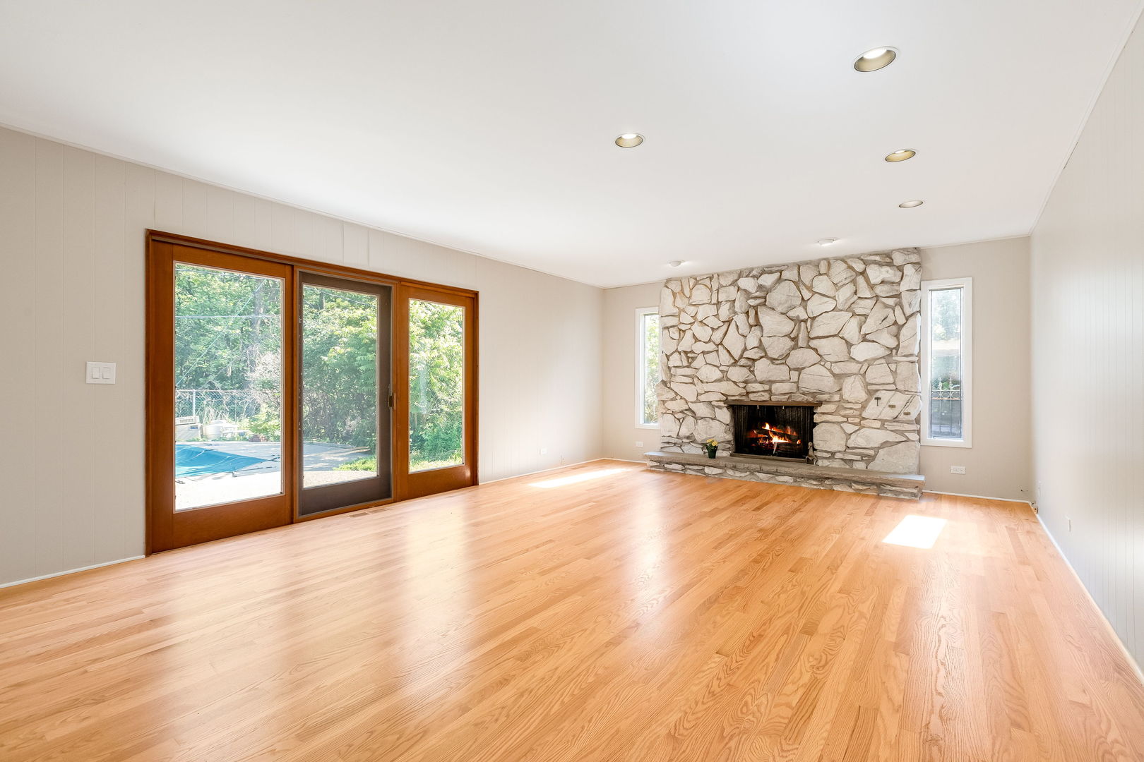 3528 Riverside Drive Wilmette, IL 60091 - Photo 5 of 33 a view of empty room with fireplace and wooden floor