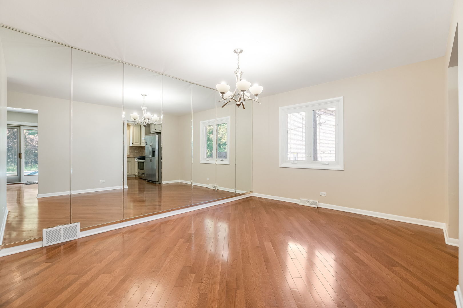 3528 Riverside Drive Wilmette, IL 60091 - Photo 6 of 33 an empty room with wooden floor and windows