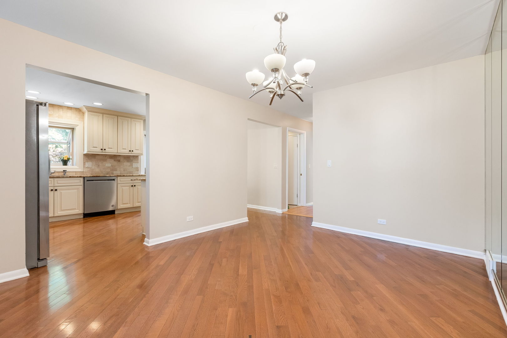 3528 Riverside Drive Wilmette, IL 60091 - Photo 7 of 33 wooden floor in an empty room with a window