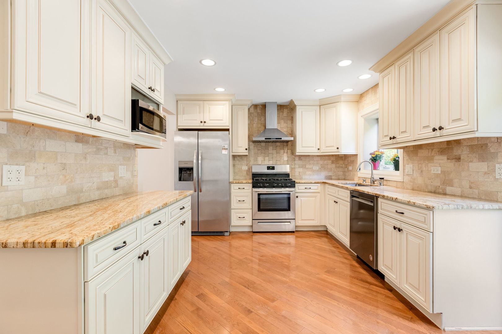 3528 Riverside Drive Wilmette, IL 60091 - Photo 8 of 33 a kitchen with stainless steel appliances granite countertop a stove sink and cabinets
