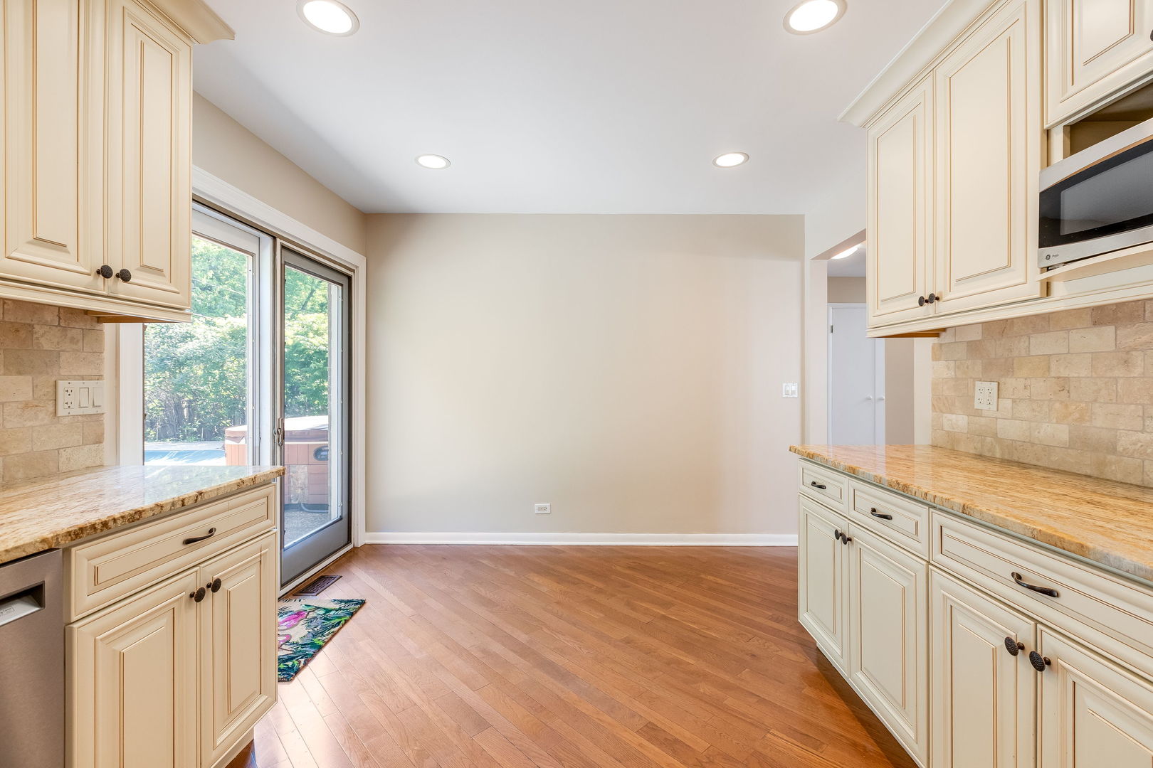 3528 Riverside Drive Wilmette, IL 60091 - Photo 9 of 33 a open kitchen with granite countertop white cabinets and white appliances