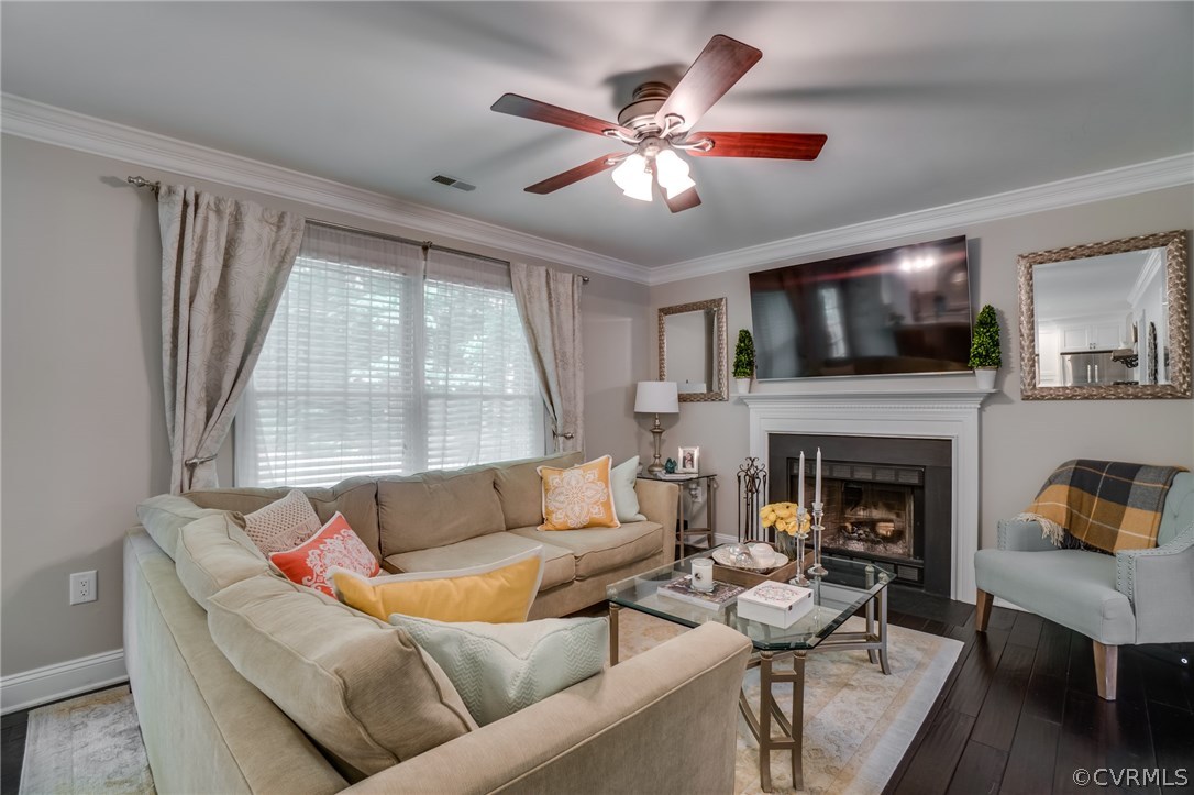 15209 Windy Ridge Road Midlothian, VA 23112 - Photo 11 of 40 a living room with furniture a fireplace and a flat screen tv