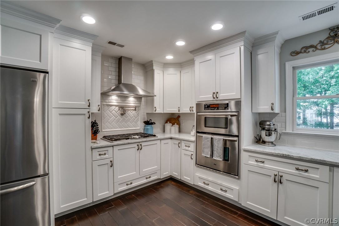 15209 Windy Ridge Road Midlothian, VA 23112 - Photo 16 of 40 a kitchen with stainless steel appliances granite countertop a refrigerator sink and stove