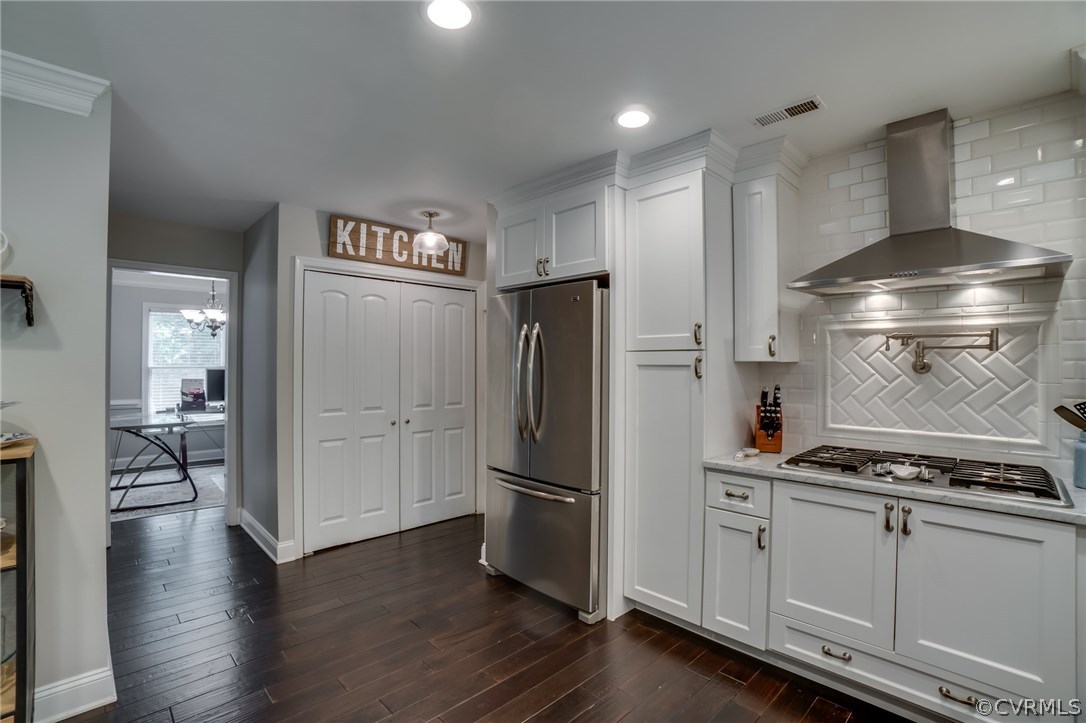 15209 Windy Ridge Road Midlothian, VA 23112 - Photo 18 of 40 a kitchen with stainless steel appliances granite countertop a refrigerator and a stove