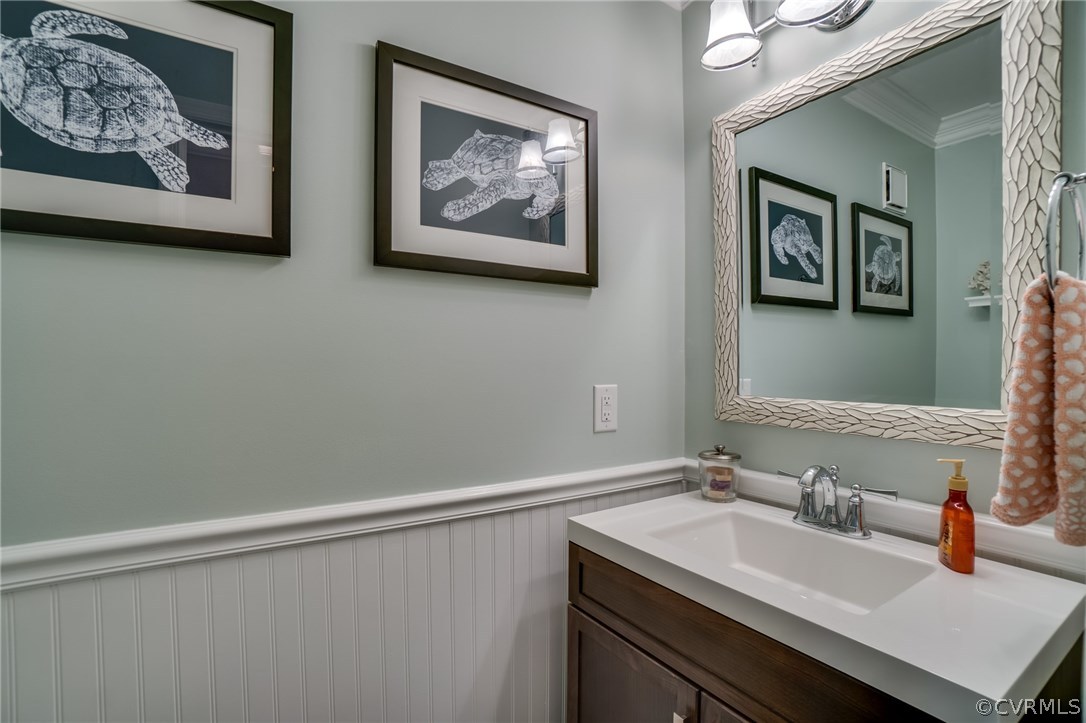 15209 Windy Ridge Road Midlothian, VA 23112 - Photo 20 of 40 a bathroom with a sink and a mirror