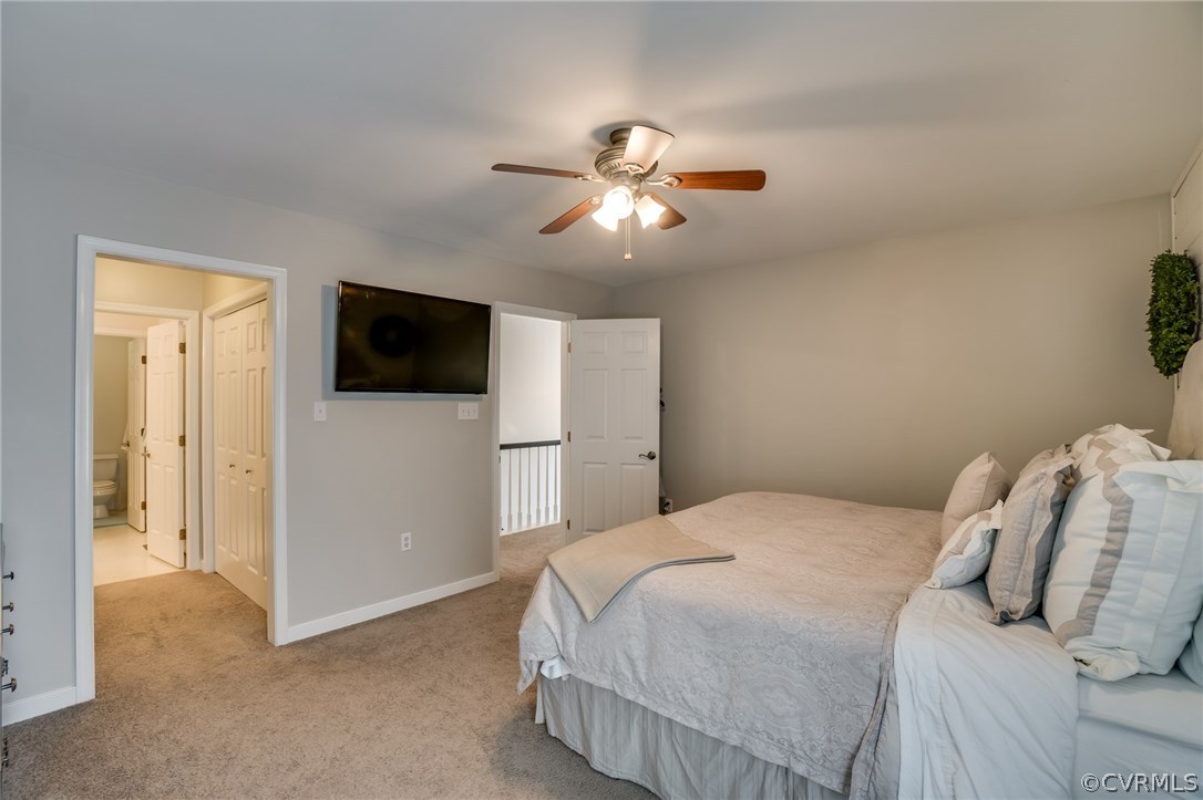 15209 Windy Ridge Road Midlothian, VA 23112 - Photo 25 of 40 a bedroom with a bed and a flat screen tv