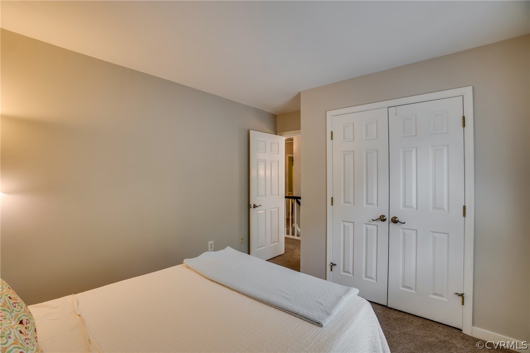 15209 Windy Ridge Road Midlothian, VA 23112 - Photo 30 of 40 a bedroom with a bed and a closet