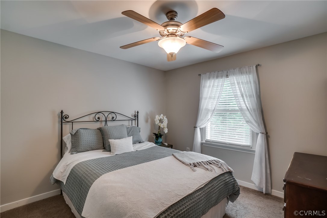 15209 Windy Ridge Road Midlothian, VA 23112 - Photo 33 of 40 a bedroom with bed and window
