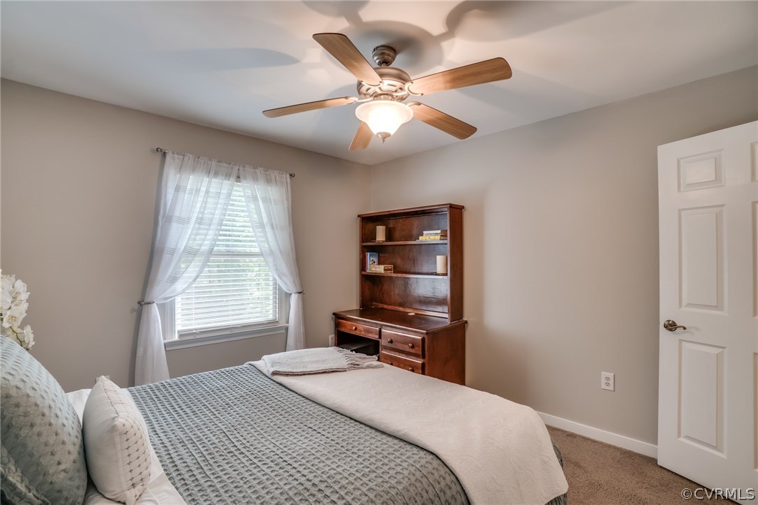 15209 Windy Ridge Road Midlothian, VA 23112 - Photo 35 of 40 a bedroom with a bed and a window