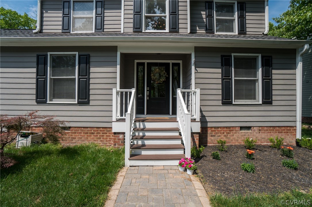 15209 Windy Ridge Road Midlothian, VA 23112 - Photo 4 of 40 a front view of a house with garden