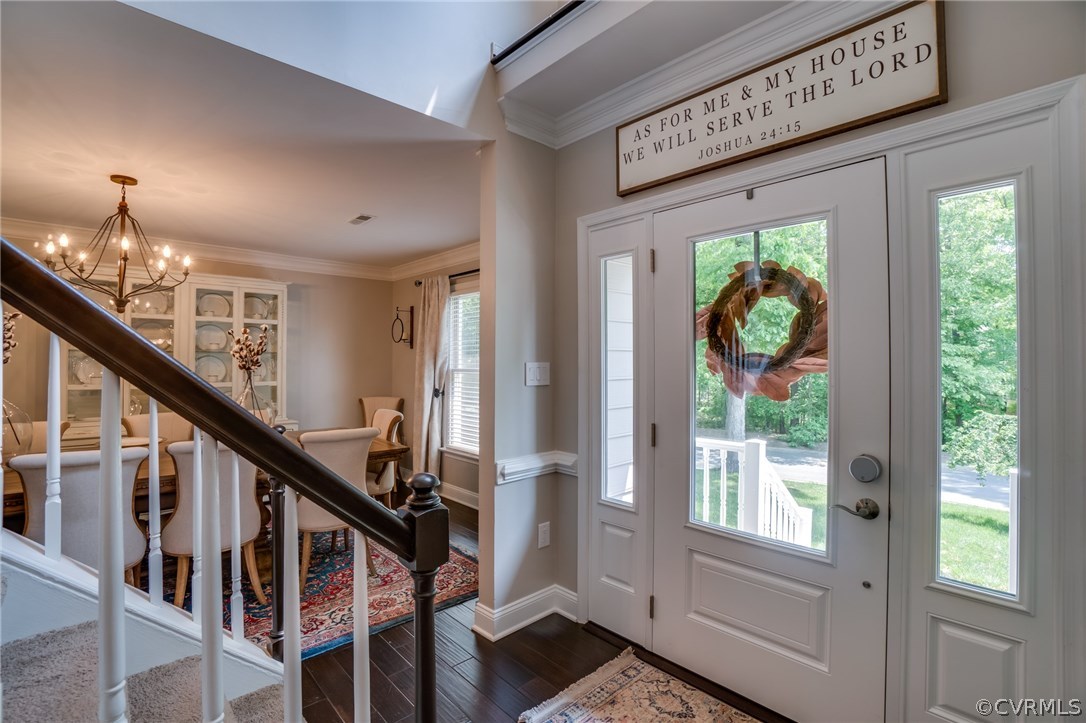 15209 Windy Ridge Road Midlothian, VA 23112 - Photo 6 of 40 a view of an entryway with wooden floor and windows