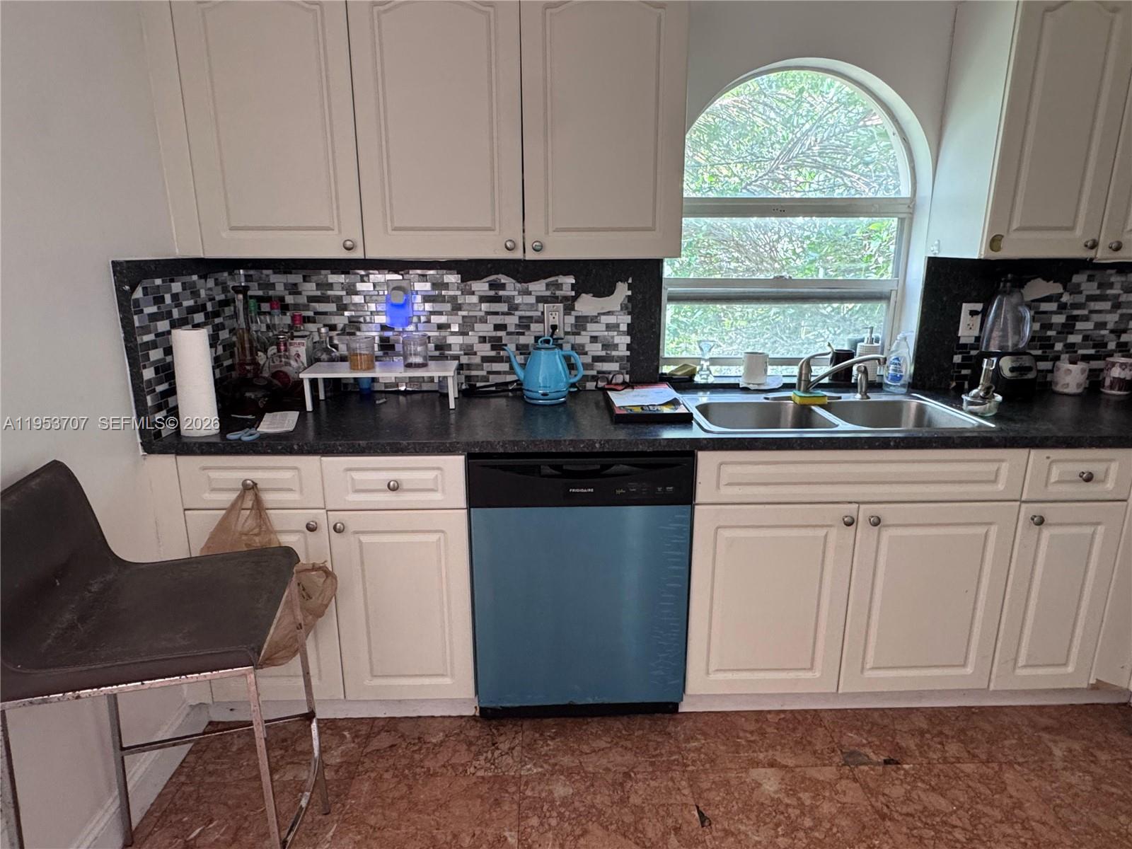 Surfside Surfside, FL 33154 - Photo 11 of 11 a kitchen with stainless steel appliances granite countertop a sink a stove a microwave a refrigerator and cabinets