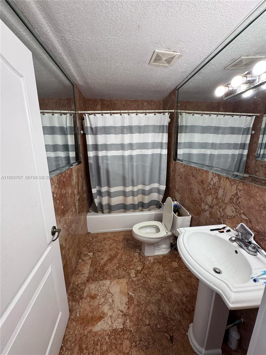 Surfside Surfside, FL 33154 - Photo 2 of 11 a bathroom with a sink and a mirror
