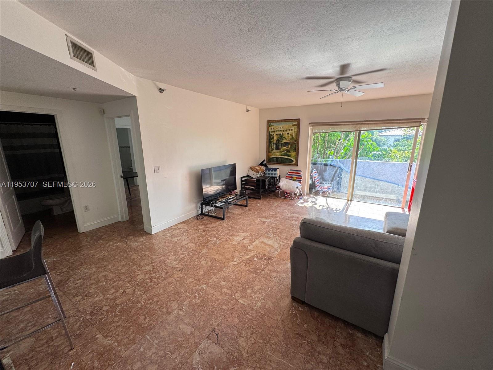 Surfside Surfside, FL 33154 - Photo 9 of 11 a living room with furniture and a window
