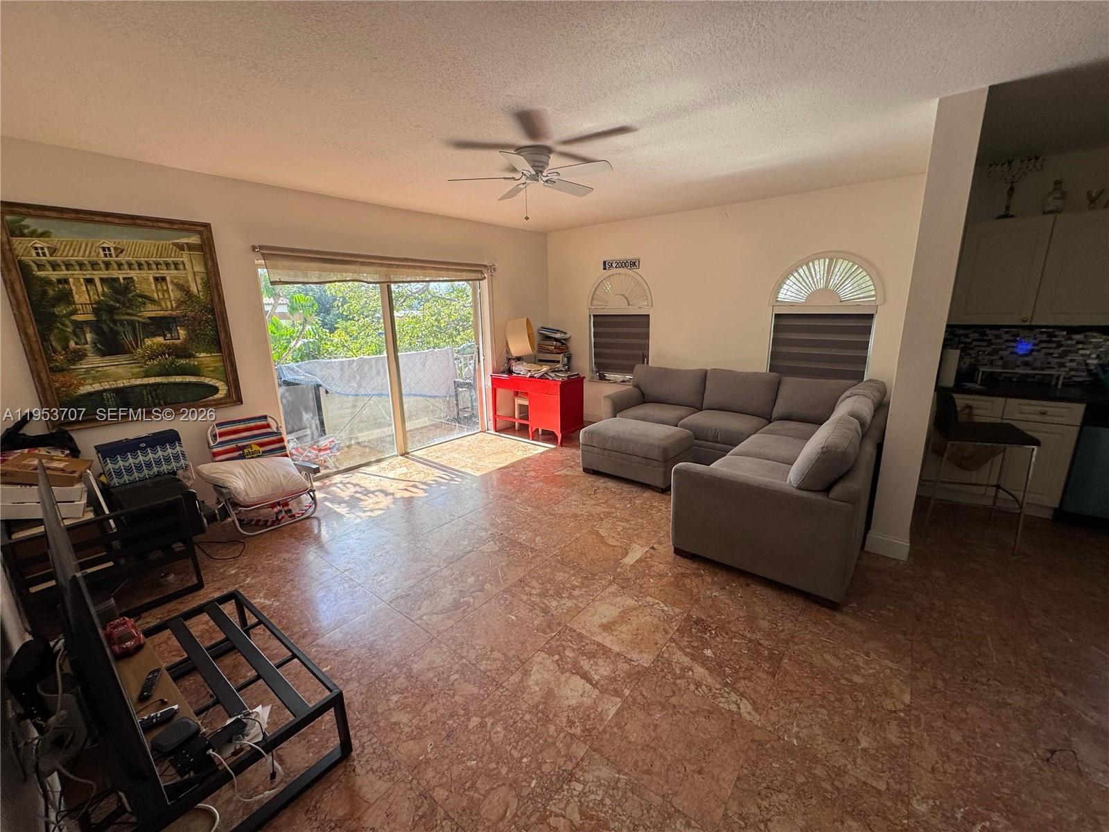 Surfside Surfside, FL 33154 - Photo 10 of 11 a living room with furniture and a flat screen tv