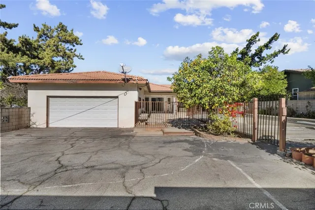 a view of a house with swimming pool and sitting area