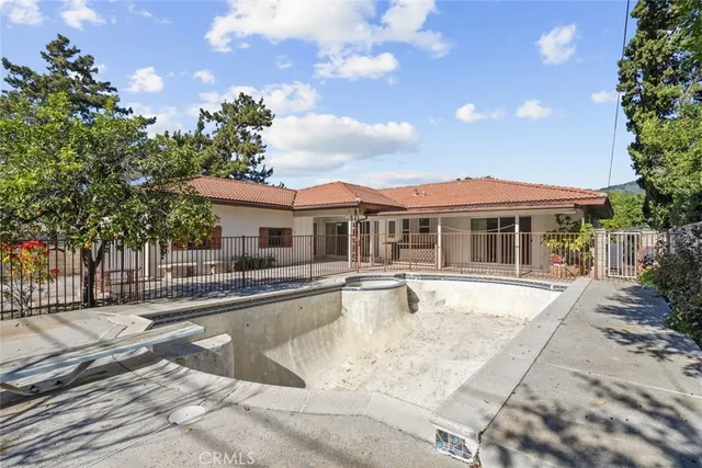 a view of a swimming pool with a lounge chairs