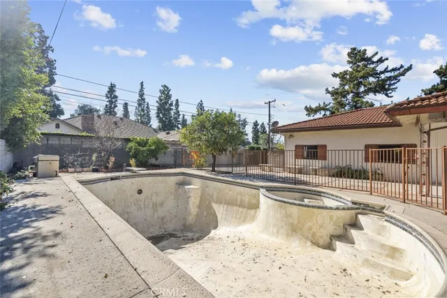 an aerial view of residential house and covered with trees