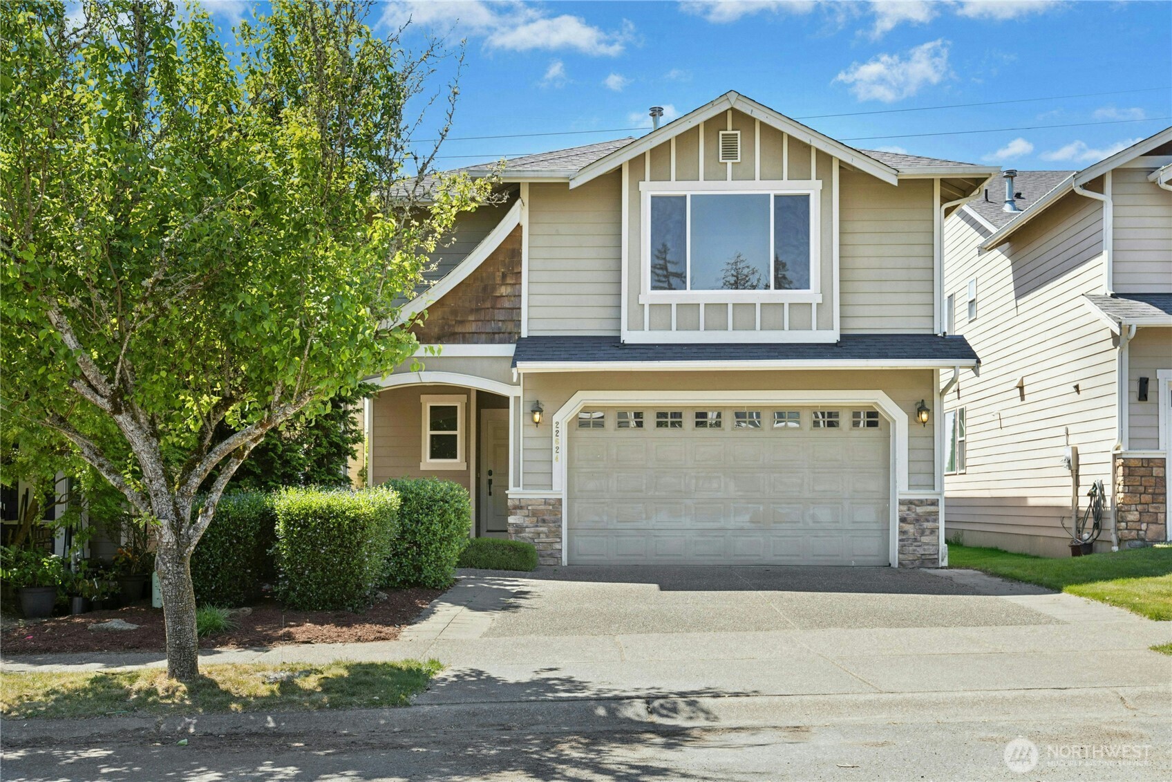 a front view of a house with yard