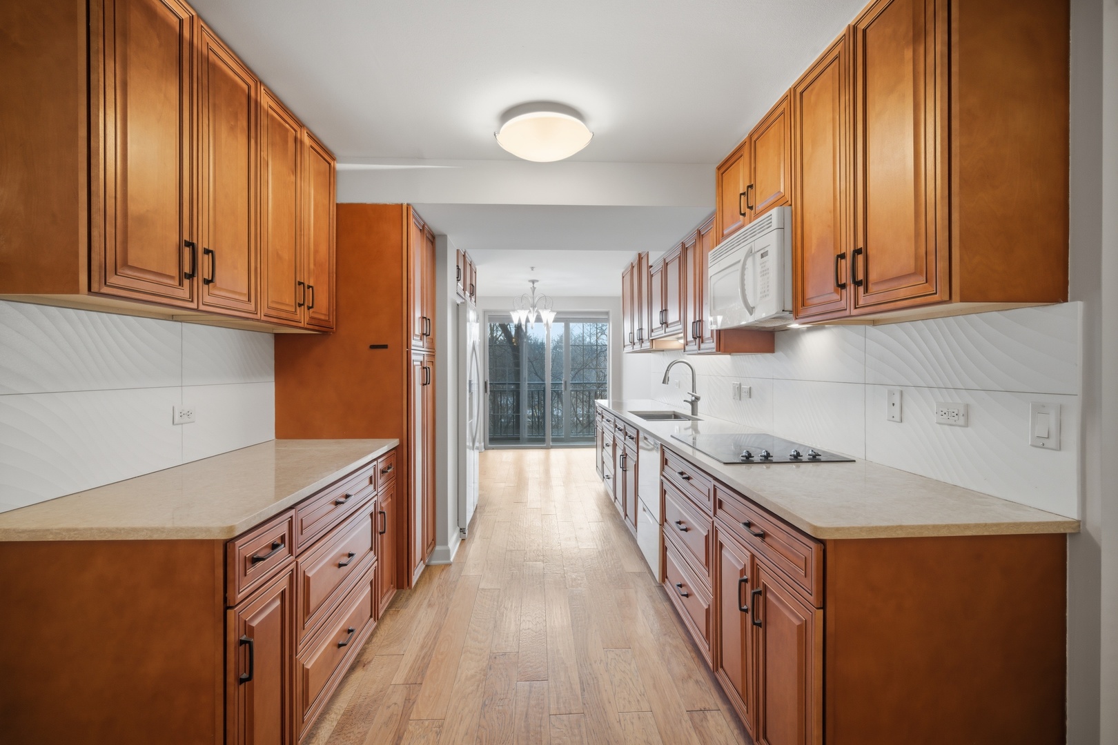 1625 Glenview Road, Unit 207 Glenview, IL 60025 - Photo 6 of 16 a kitchen with a sink a stove and cabinets