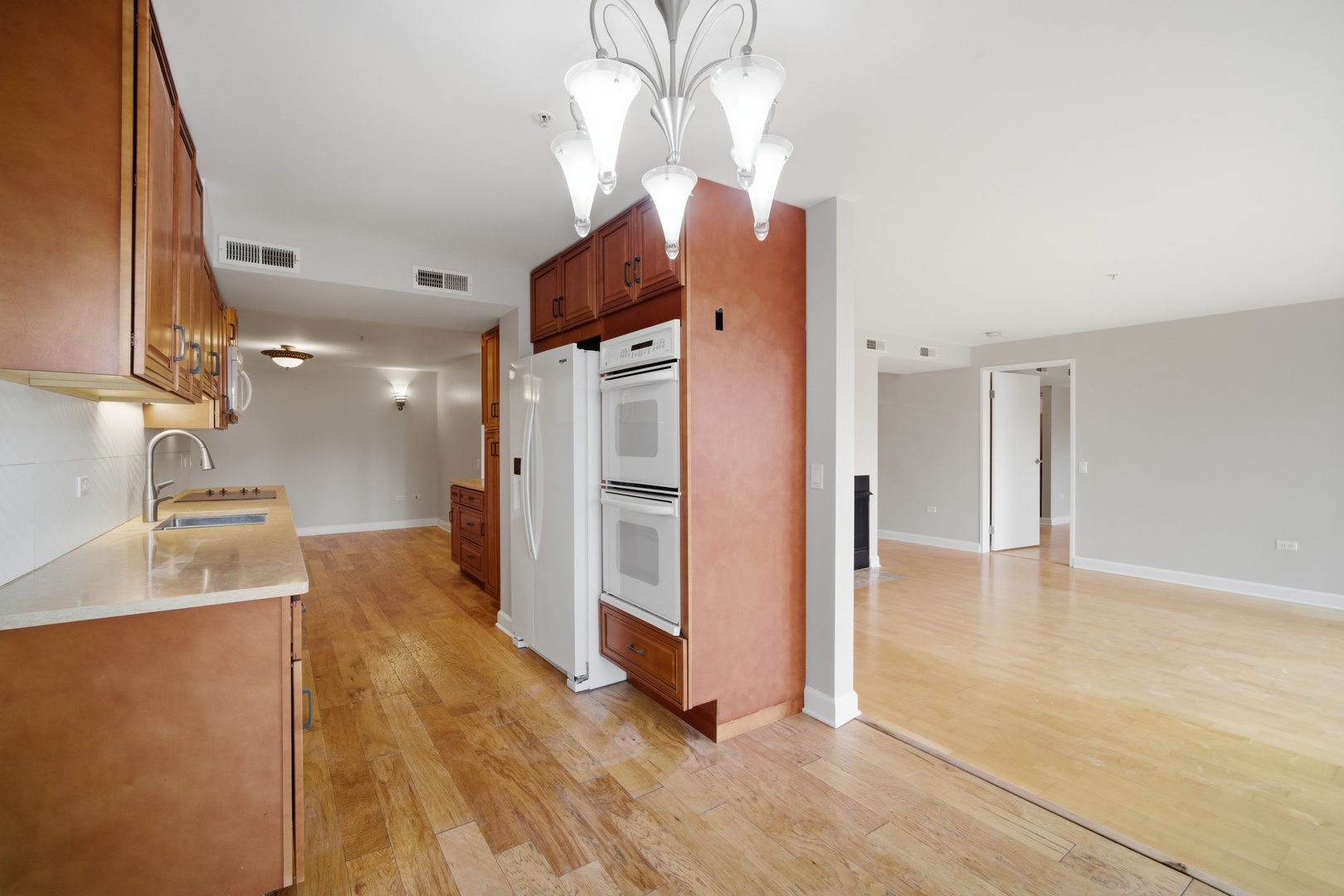 1625 Glenview Road, Unit 207 Glenview, IL 60025 - Photo 7 of 16 a view of a kitchen with a sink and a refrigerator