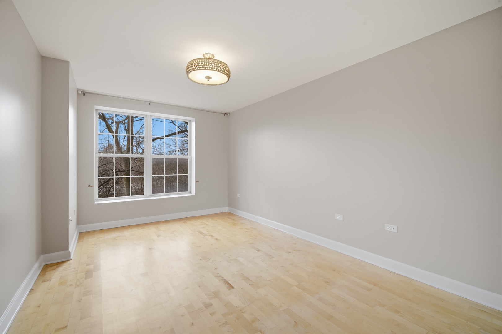 1625 Glenview Road, Unit 207 Glenview, IL 60025 - Photo 8 of 16 an empty room with a window