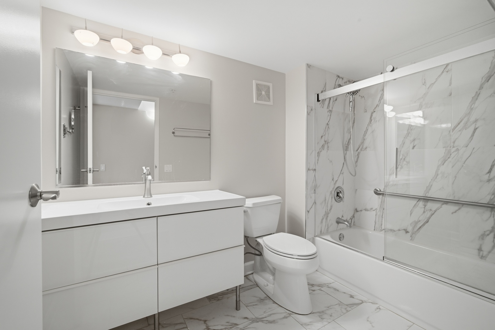 1625 Glenview Road, Unit 207 Glenview, IL 60025 - Photo 9 of 16 a bathroom with a toilet sink and mirror
