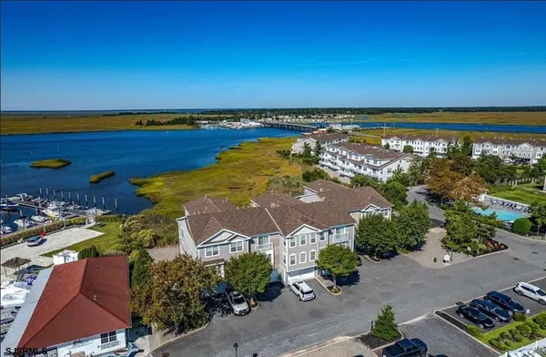an aerial view of a house with a lake view