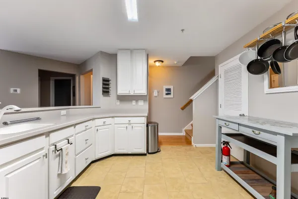 a kitchen with granite countertop a sink and a stove