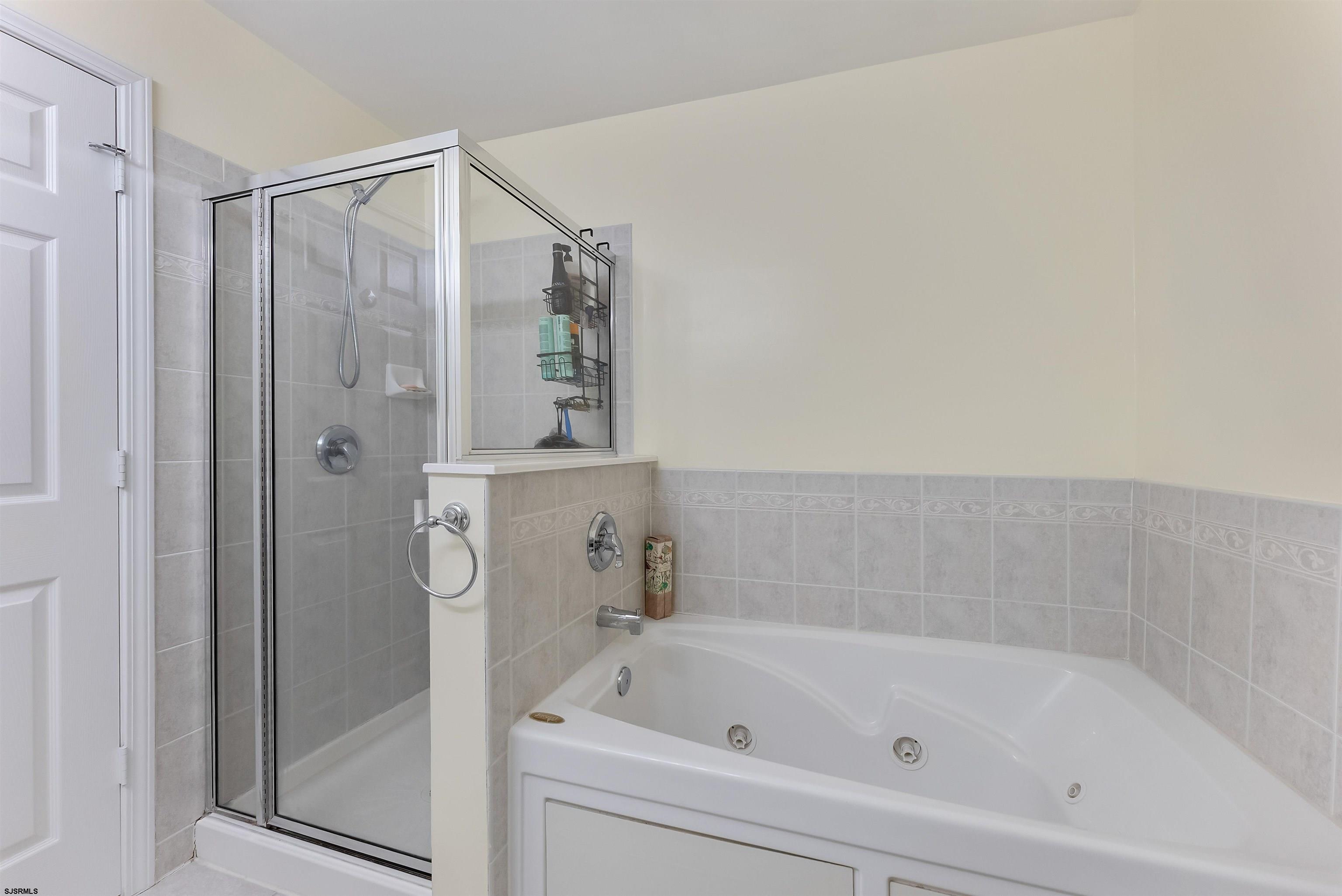 3 Bayside Drive, Unit 3 Somers Point, NJ 08244 - Photo 15 of 30 a bathroom with a bathtub and a shower