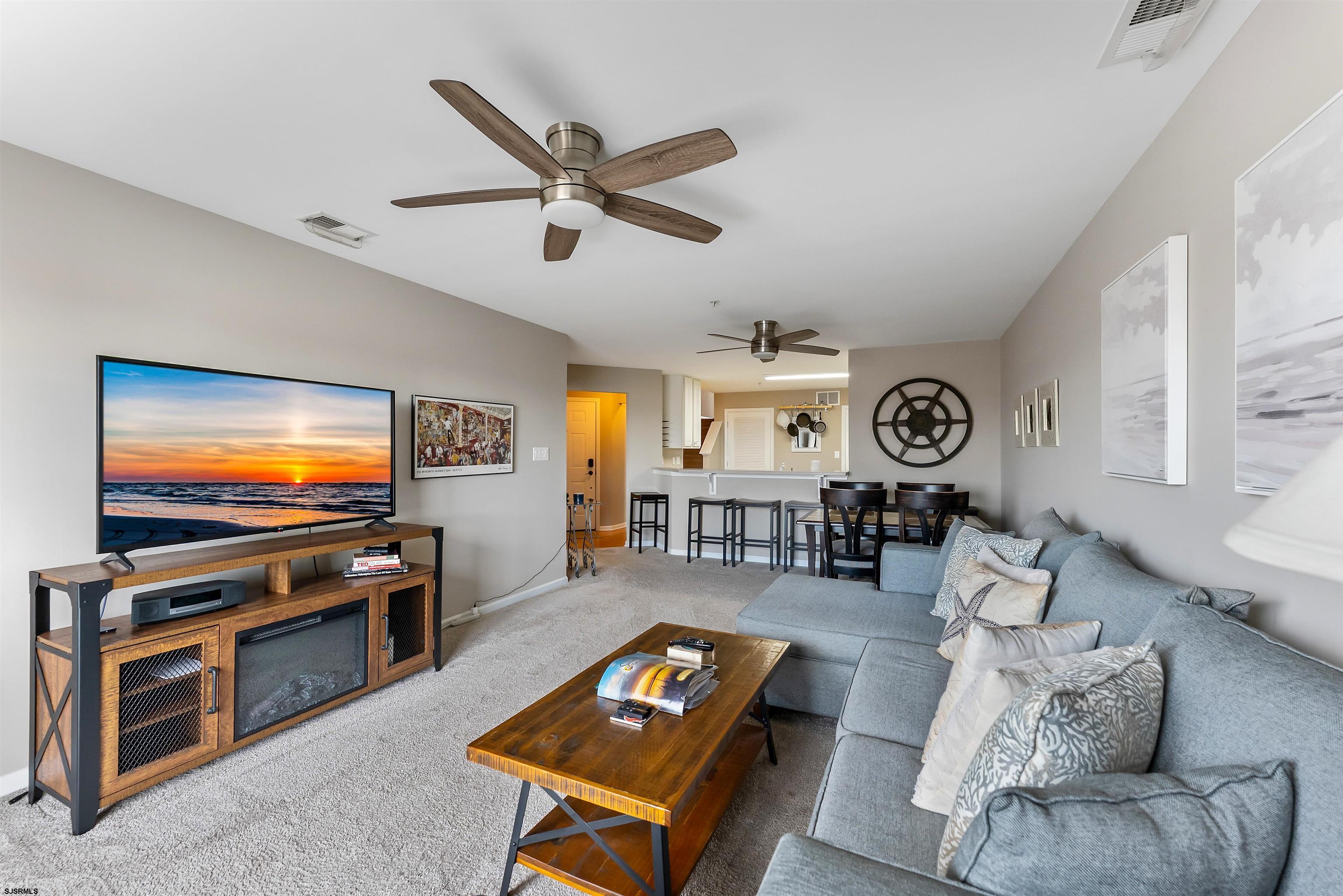 3 Bayside Drive, Unit 3 Somers Point, NJ 08244 - Photo 4 of 30 a living room with furniture and a flat screen tv