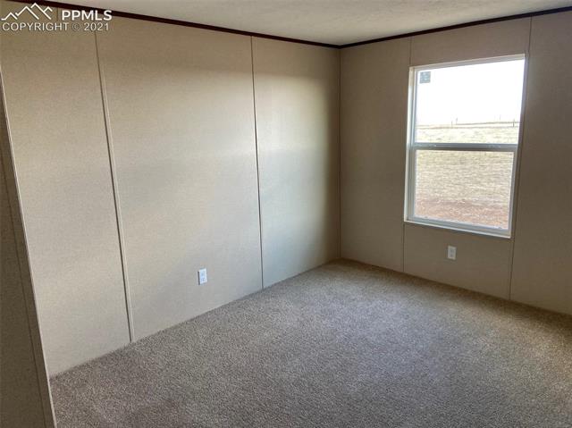 1270 Sengbeil Road Yoder, CO 80864 - Photo 7 of 10 One of 3 additional bedrooms.