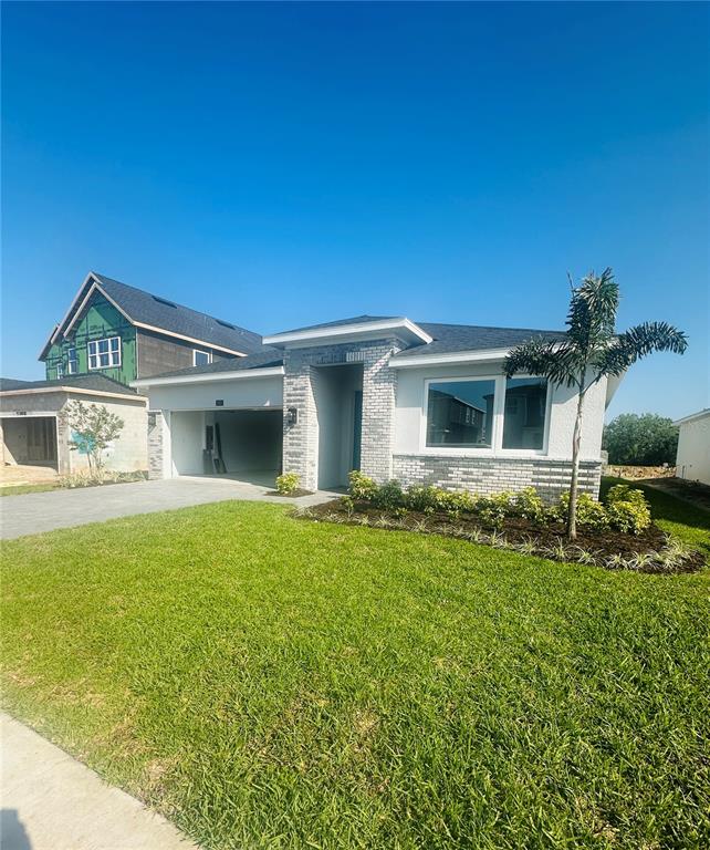 1515 Ridgeback Lane Apopka, FL 32703 - Photo 1 of 1 a front view of a house with garden
