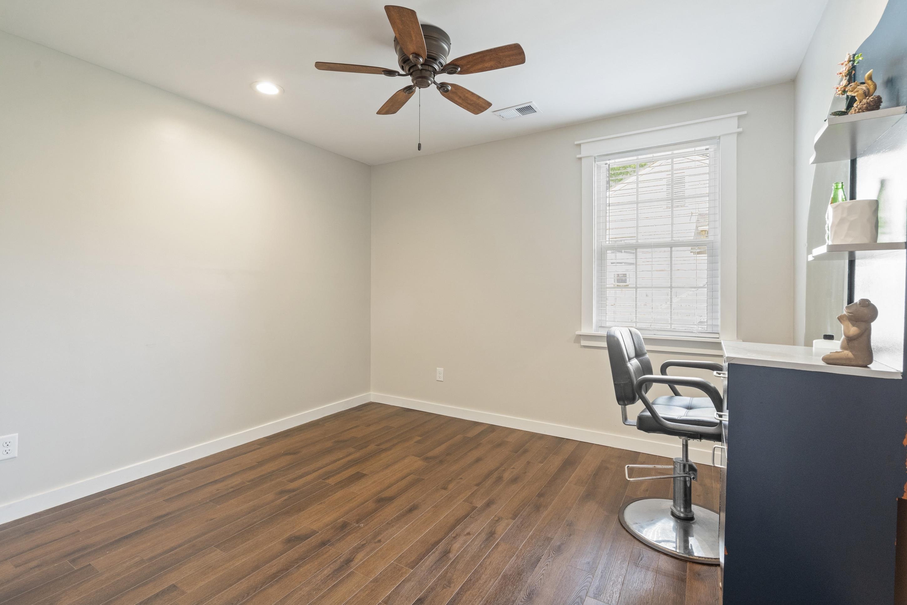 4370 Given Avenue Memphis, TN 38122 - Photo 15 of 30 Room featuring wood-finish flooring, light neutral walls, and a white-trimmed window