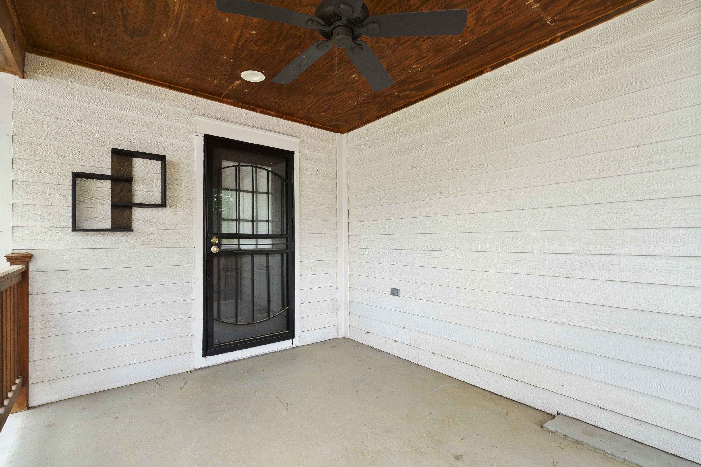 4370 Given Avenue Memphis, TN 38122 - Photo 17 of 30 Covered exterior patio featuring white horizontal siding and a wood-finish ceiling