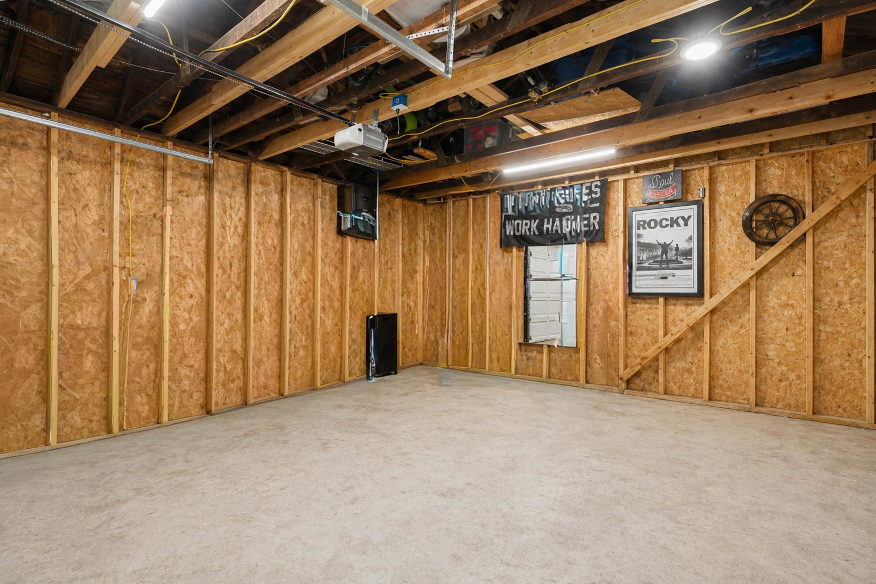 4370 Given Avenue Memphis, TN 38122 - Photo 18 of 30 Unfinished basement with exposed ceiling joists and wood-paneled walls