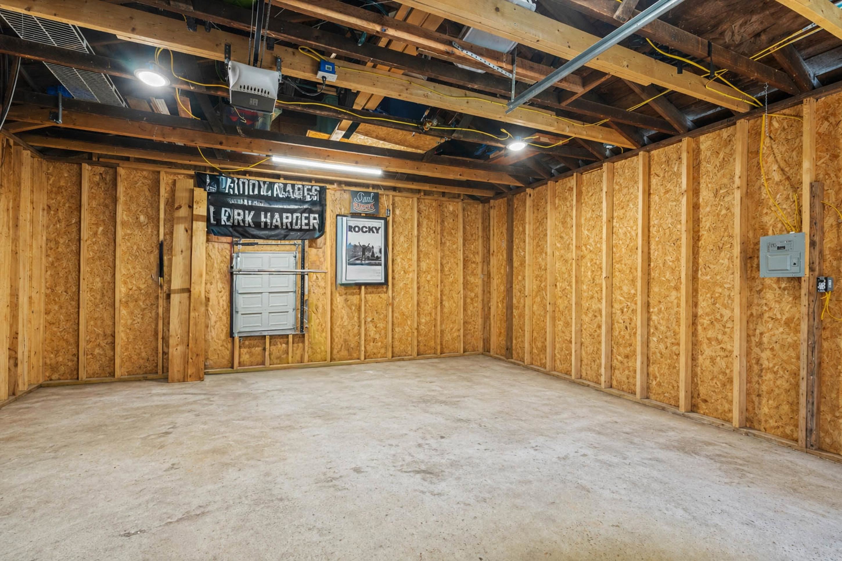 4370 Given Avenue Memphis, TN 38122 - Photo 20 of 30 Spacious unfinished garage featuring exposed wooden beams and concrete flooring