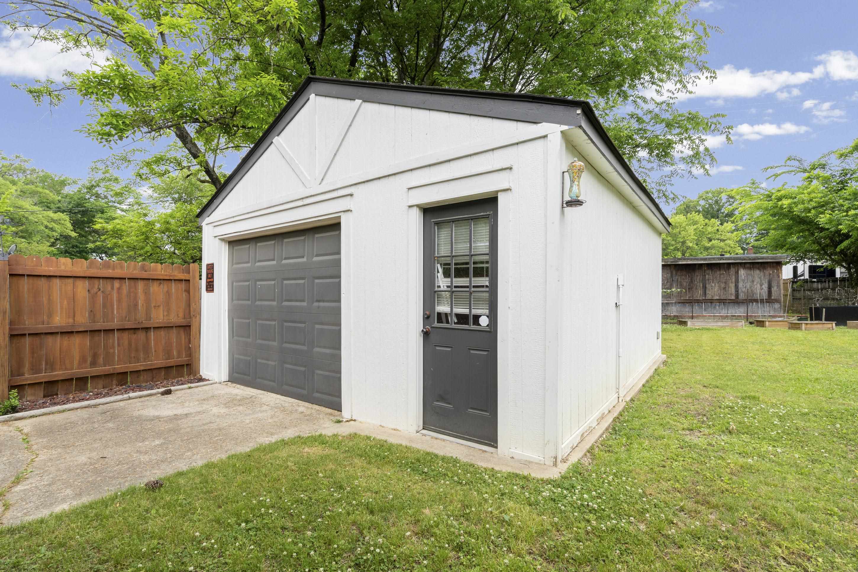 4370 Given Avenue Memphis, TN 38122 - Photo 2 of 30 Detached outbuilding with a single garage bay, separate entry door, and exterior lighting fixture