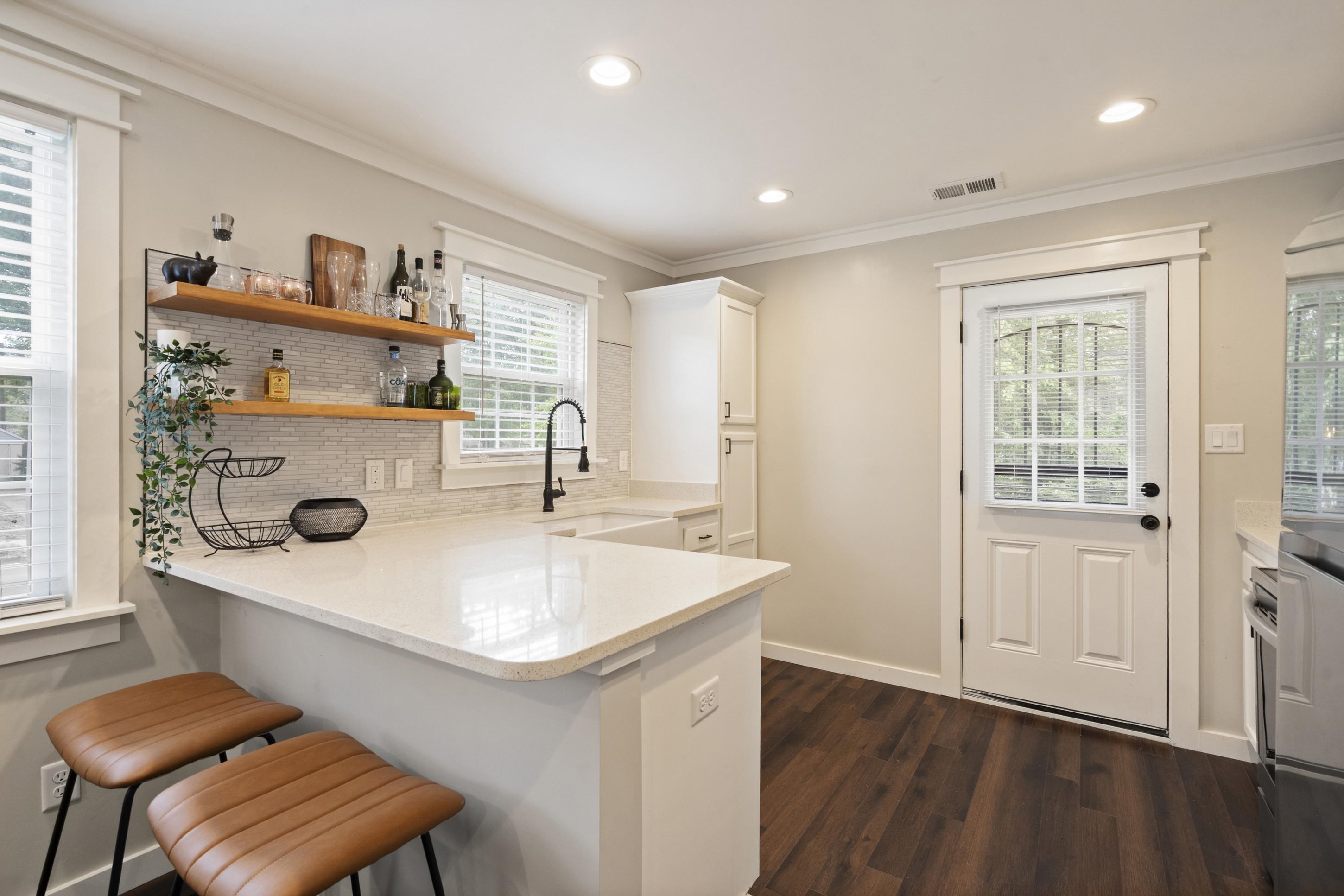 4370 Given Avenue Memphis, TN 38122 - Photo 5 of 30 Kitchen featuring wood-finish flooring, recessed lighting, and a white paneled door with integrated blinds