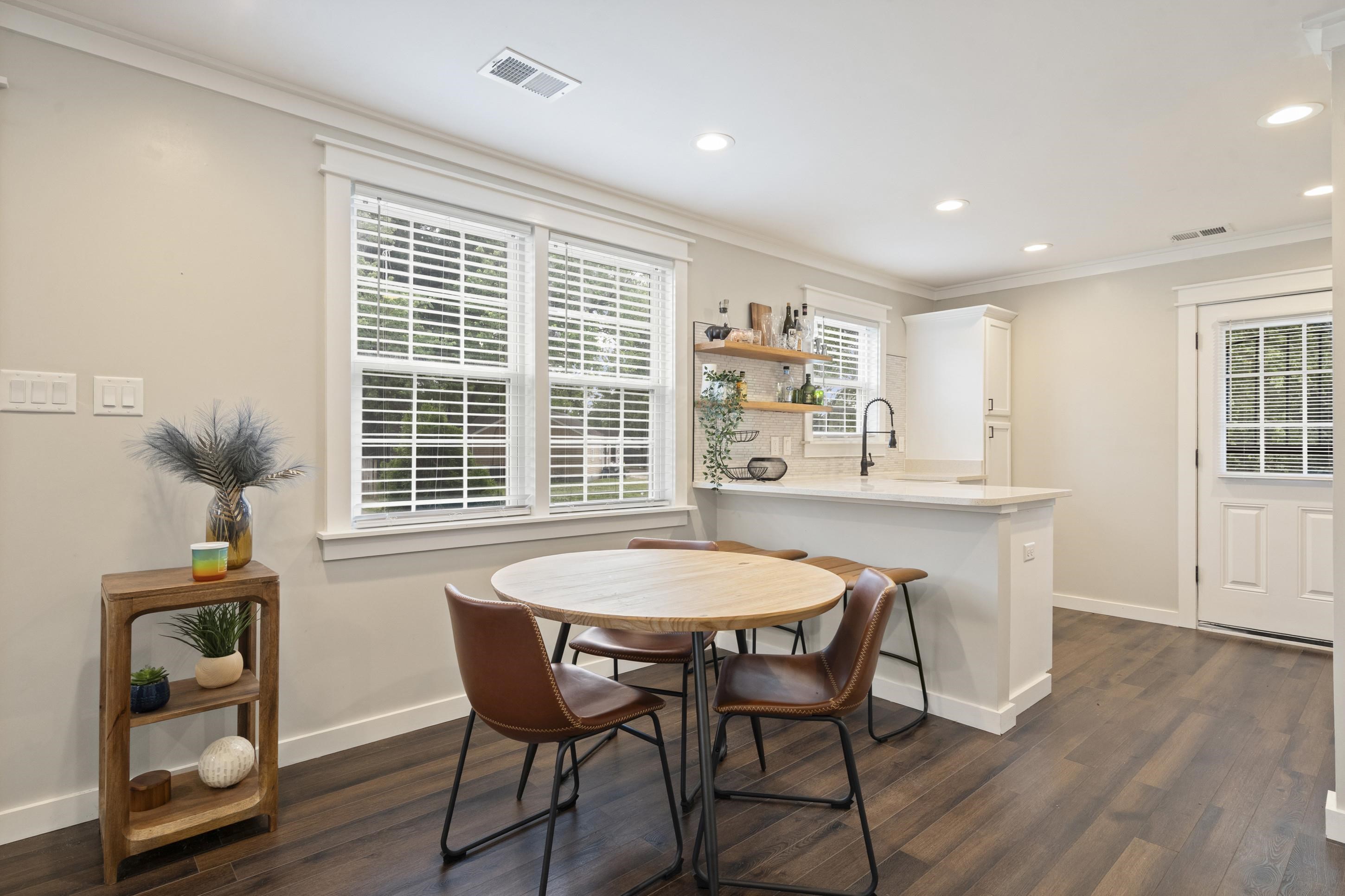 4370 Given Avenue Memphis, TN 38122 - Photo 6 of 30 Open-concept living space featuring wood-finish flooring, recessed lighting, and crown molding