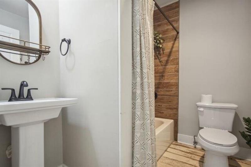 1384 Lanvale Drive Southwest Atlanta, GA 30310 - Photo 14 of 14 a bathroom with a sink a toilet and a mirror