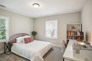 a bedroom with a bed and with furniture