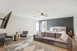 a living room with furniture and a chandelier
